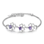 Fine 925 sterling silver bracelet featuring a purple crystal four-leaf clover charm, designed for women as a stylish accessory for parties, weddings, and special occasions.